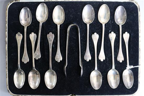 A cased set of twelve 1930s 17th century style dog nose rat tail coffee spoon and pair of sugar tongs.